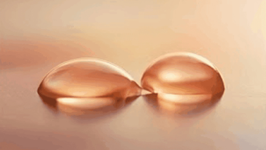 Two water drops merging